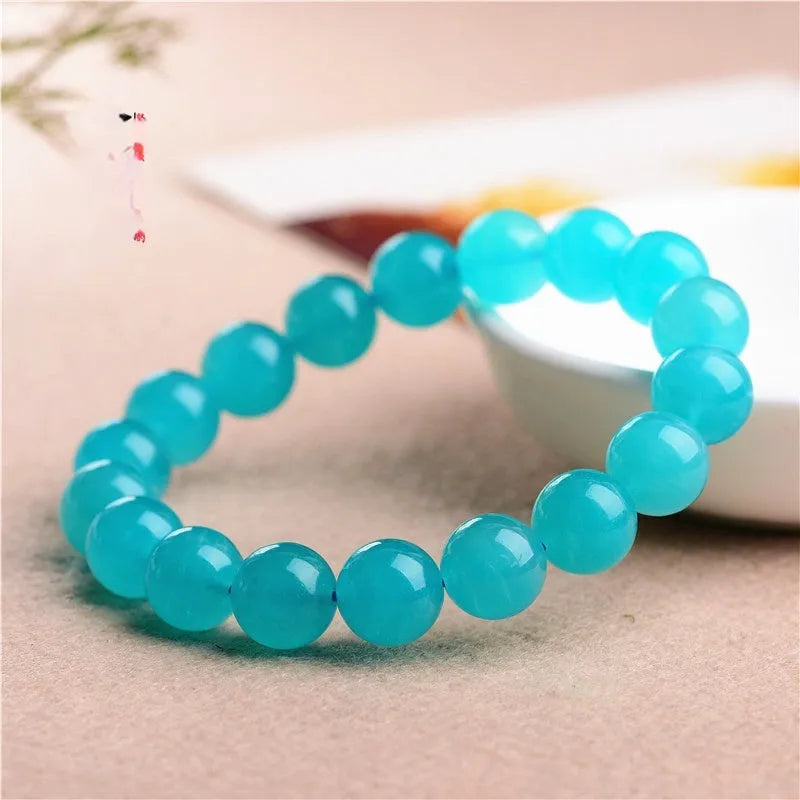 Grade 7A Amazonite natural stone scattered beads in ice colours for bracelet making, shown with a finished crystal bracelet.