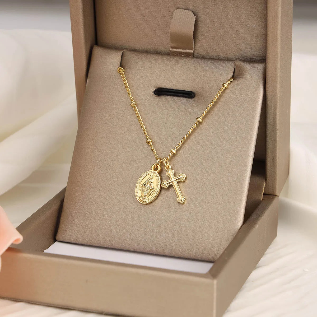 Gold cross pendant necklace with Virgin Mary ornament on geometric 2.5 cm pendant