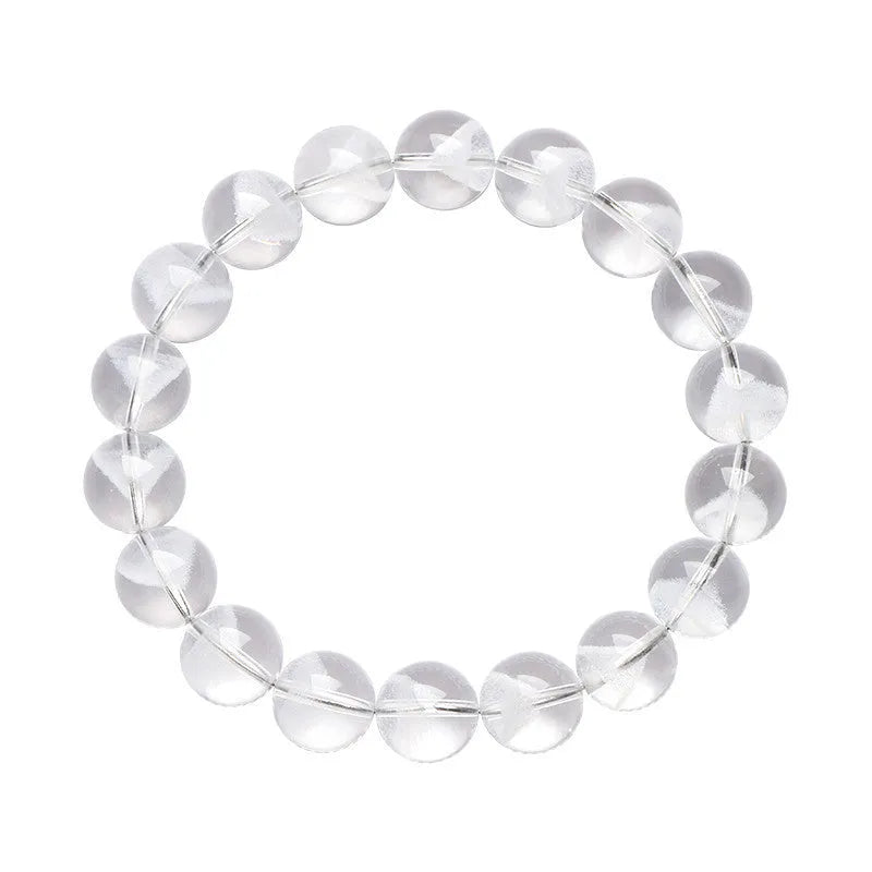 Women's white crystal pyramid bead bracelet with a Ruyi charm on a wrist.