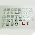 3D metal car letter stickers showing raised zinc alloy characters in black and silver finishes