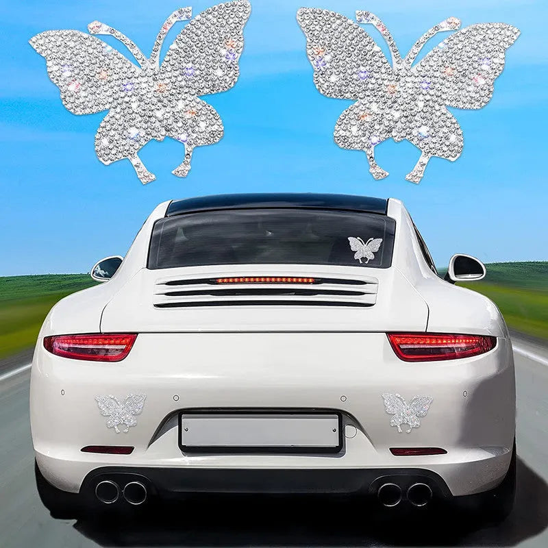 Glass car sticker with diamond-encrusted butterfly and bear paw design, 7cm by 6cm.