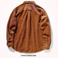 Caramel loose fit corduroy long sleeve shirt with cardigan style on a hanger.