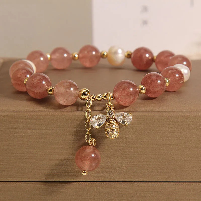 Women's strawberry quartz and freshwater pearl bracelet with zircon details and alloy charms