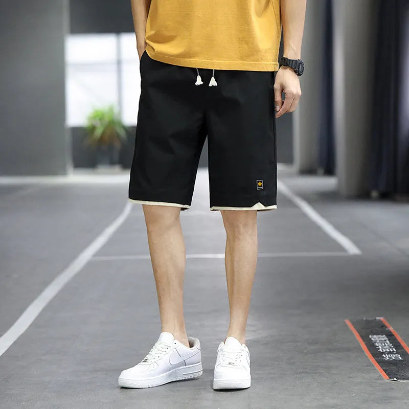 Loose straight-leg polyester beach shorts with elastic waist in multiple colour options