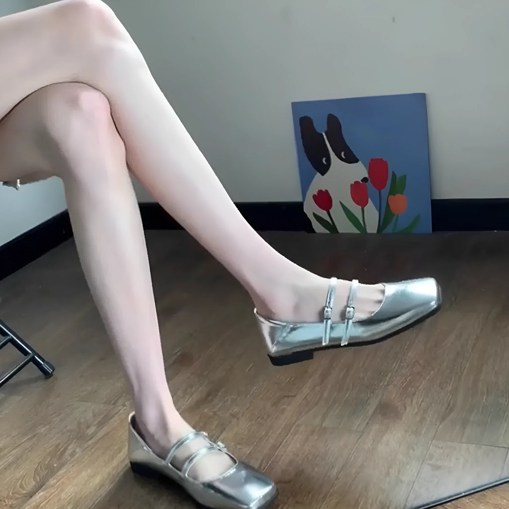 Women's silver genuine leather Mary Jane ballet flats with a cross buckle strap and flat heel.