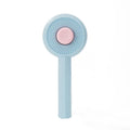 Blue pet grooming brush with angled metal pins and self-cleaning button for dogs and cats