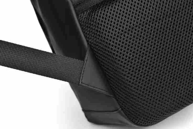 Large waterproof backpack in black with sewing thread detailing and included computer bag