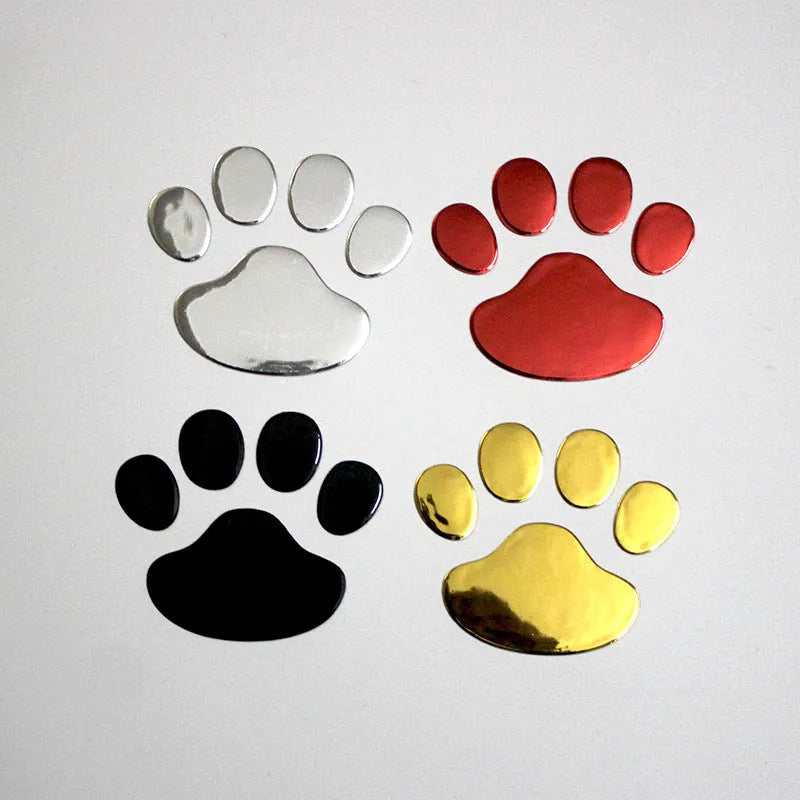 Pair of hand-shaped dog footprint car stickers in four colour options, each 7 cm long.