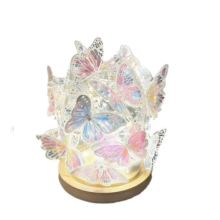 Butterfly shaped night lamp with glass shade and raw wood base on bedside table