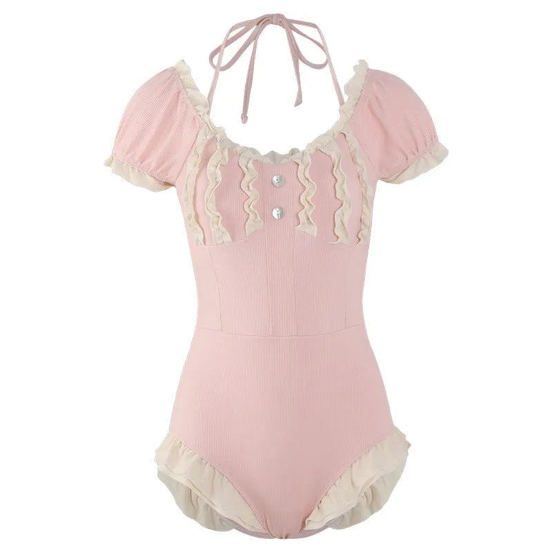 Pink women's one-piece swimsuit in conservative style with nylon fabric