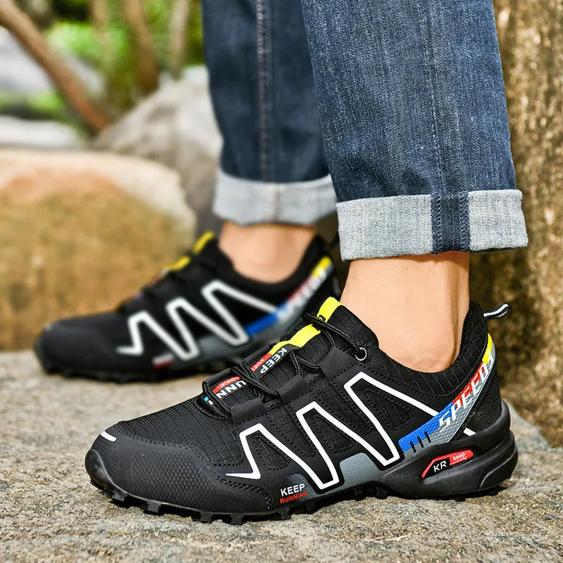 Men's grey and orange casual shoe with synthetic leather upper and non-slip rubber sole.