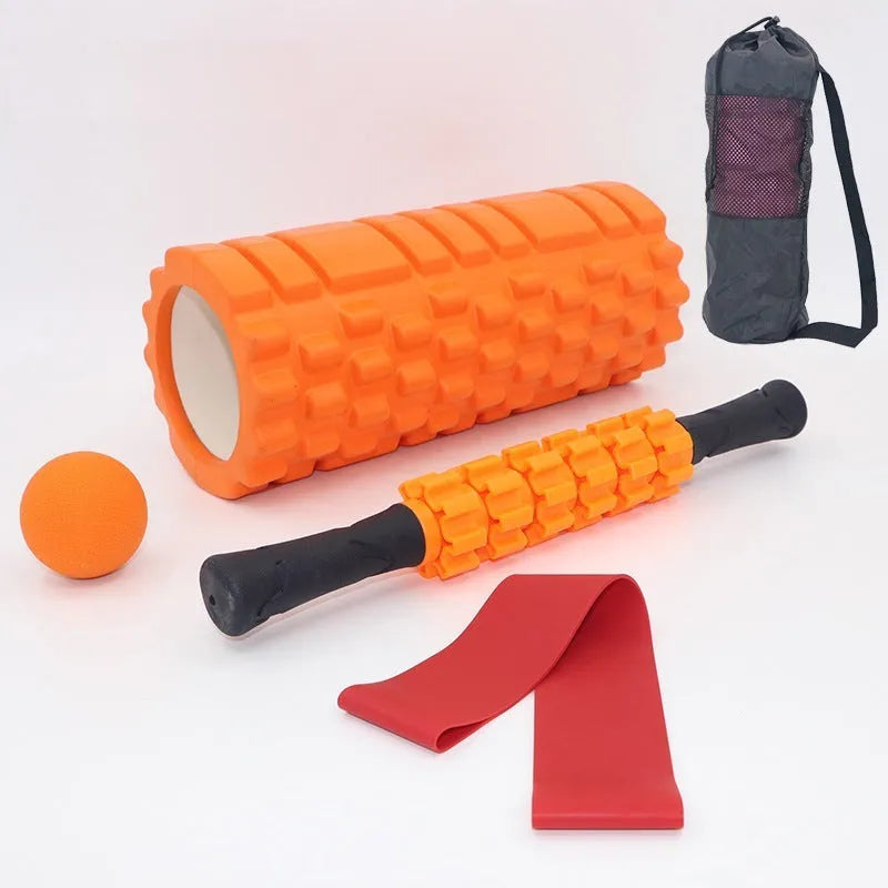 Black foam roller massage stick with gear design, 33cm long, on a plain background.