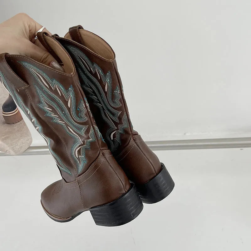 Brown women's embroidered Martin boots with a mid-calf height and low square heel.
