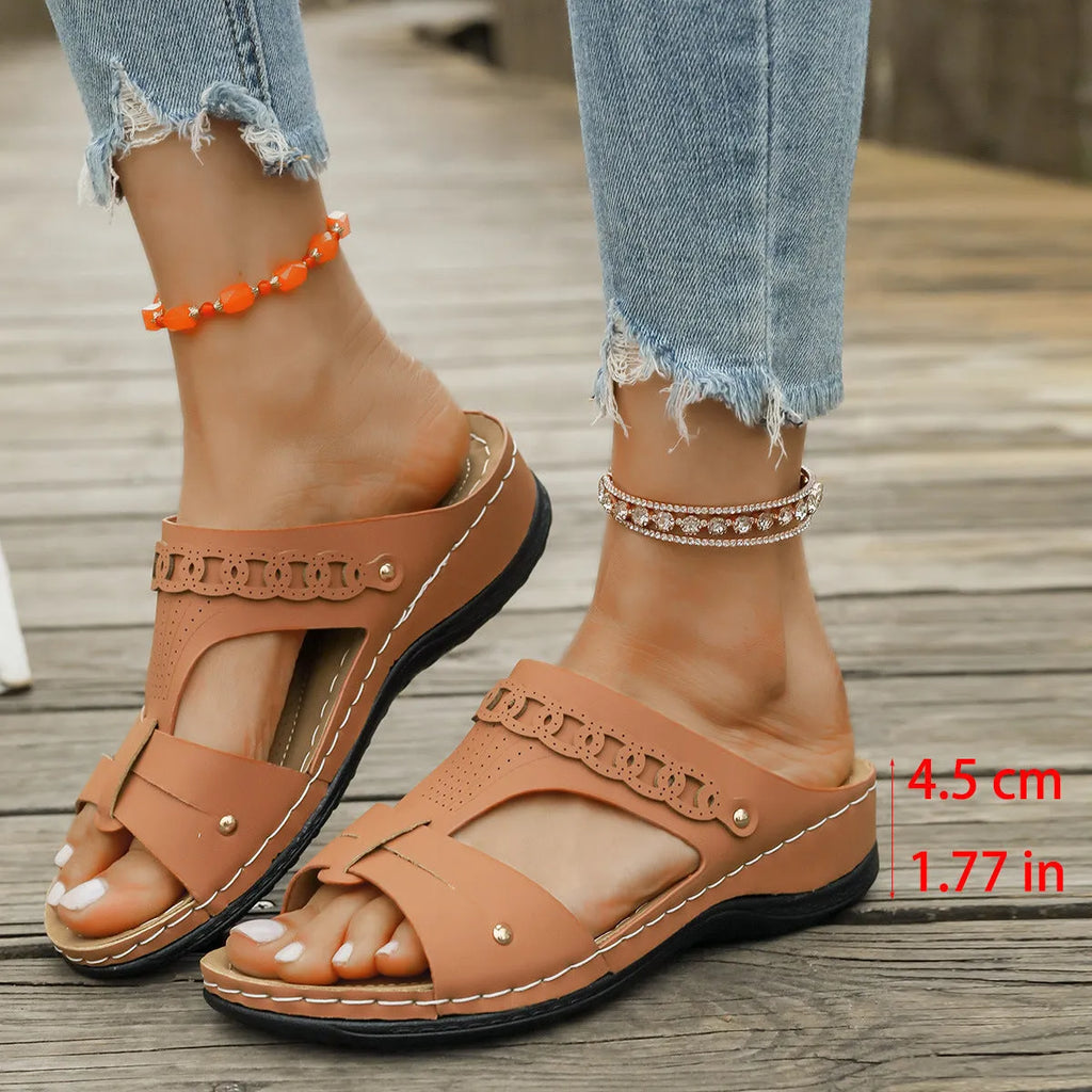 Casual slope heel roman style slippers in blue with fish mouth toe design and rubber sole.