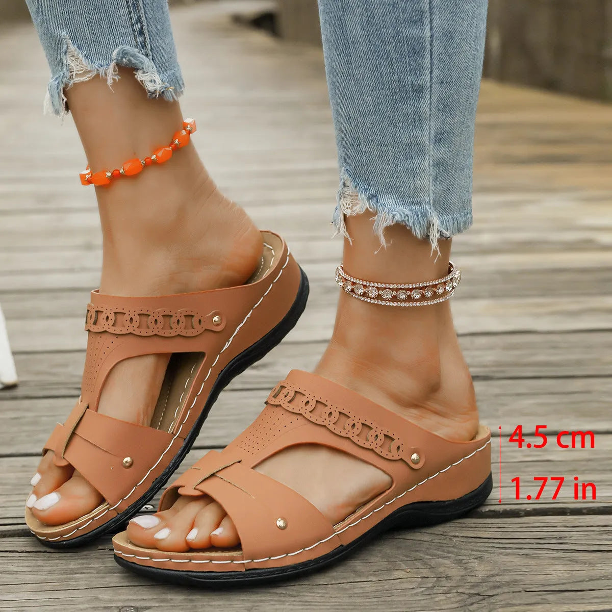 Casual slope heel roman style slippers in blue with fish mouth toe design and rubber sole.