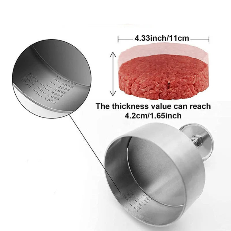 Silver stainless steel patty mould with 14cm diameter on a kitchen counter