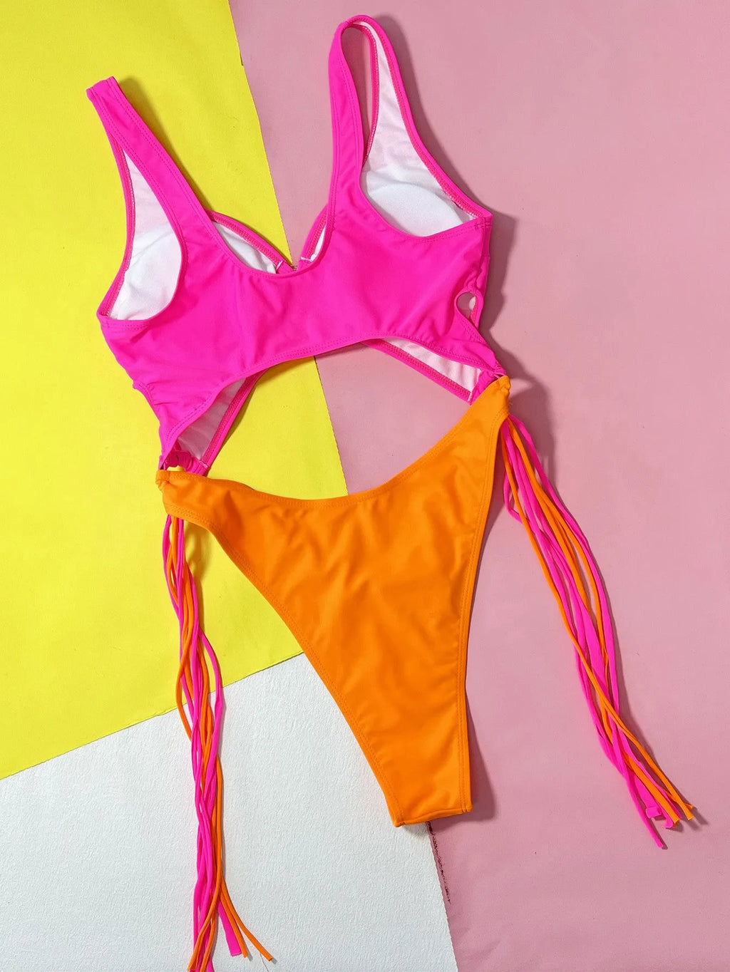 Women's Rose Red one-piece swimsuit with hollow-out steel ring and tassel detail