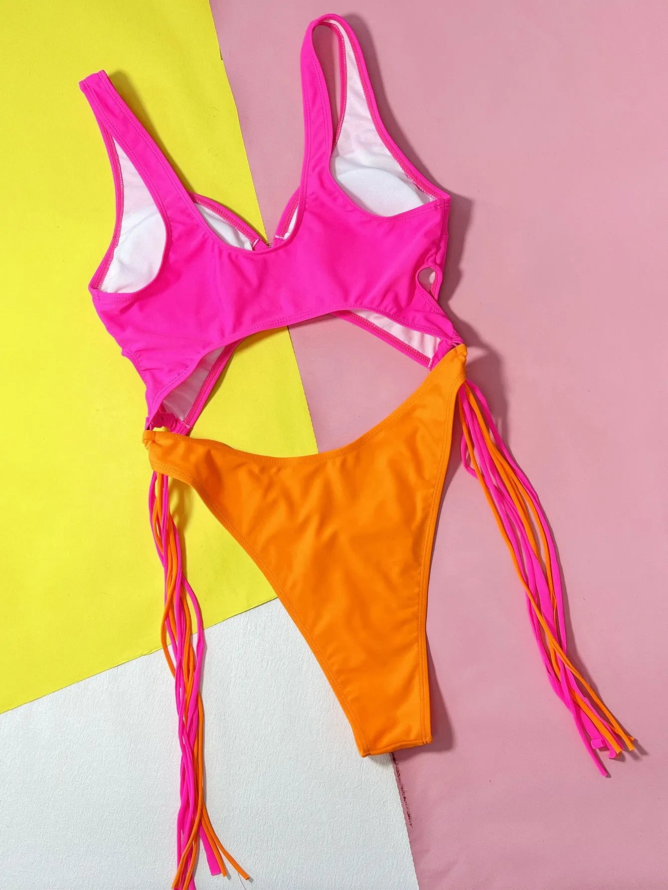 Women's Rose Red one-piece swimsuit with hollow-out steel ring and tassel detail