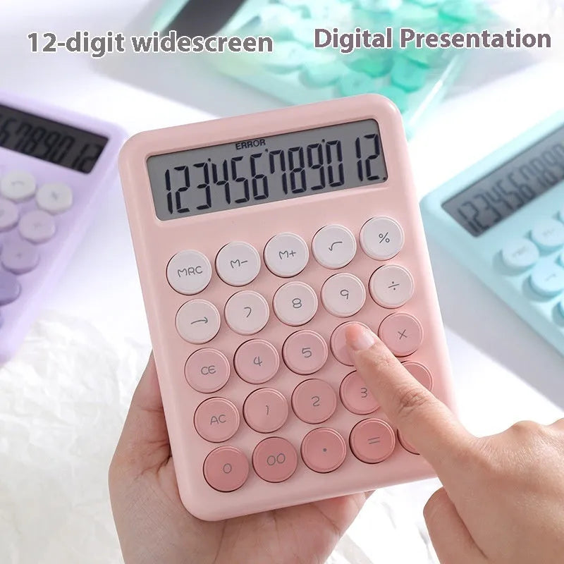 Gradient colour desk calculator in violet, cherry blossom pink, blue, and mint green finishes on a desk.