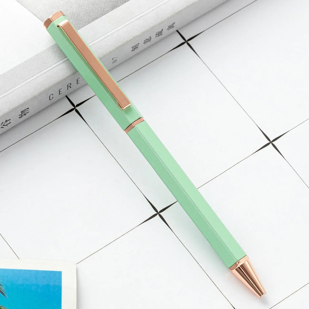 Metal ballpoint pen with six-angle rod body and bullet tip in black colour on white background