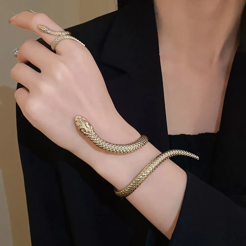 Snake-inspired ring and bracelet set with exaggerated twisted winding design in gold electroplated metal