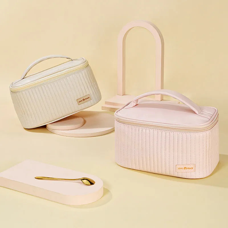 Structured open-top women's makeup bag in PU leather, shown in a solid colour.