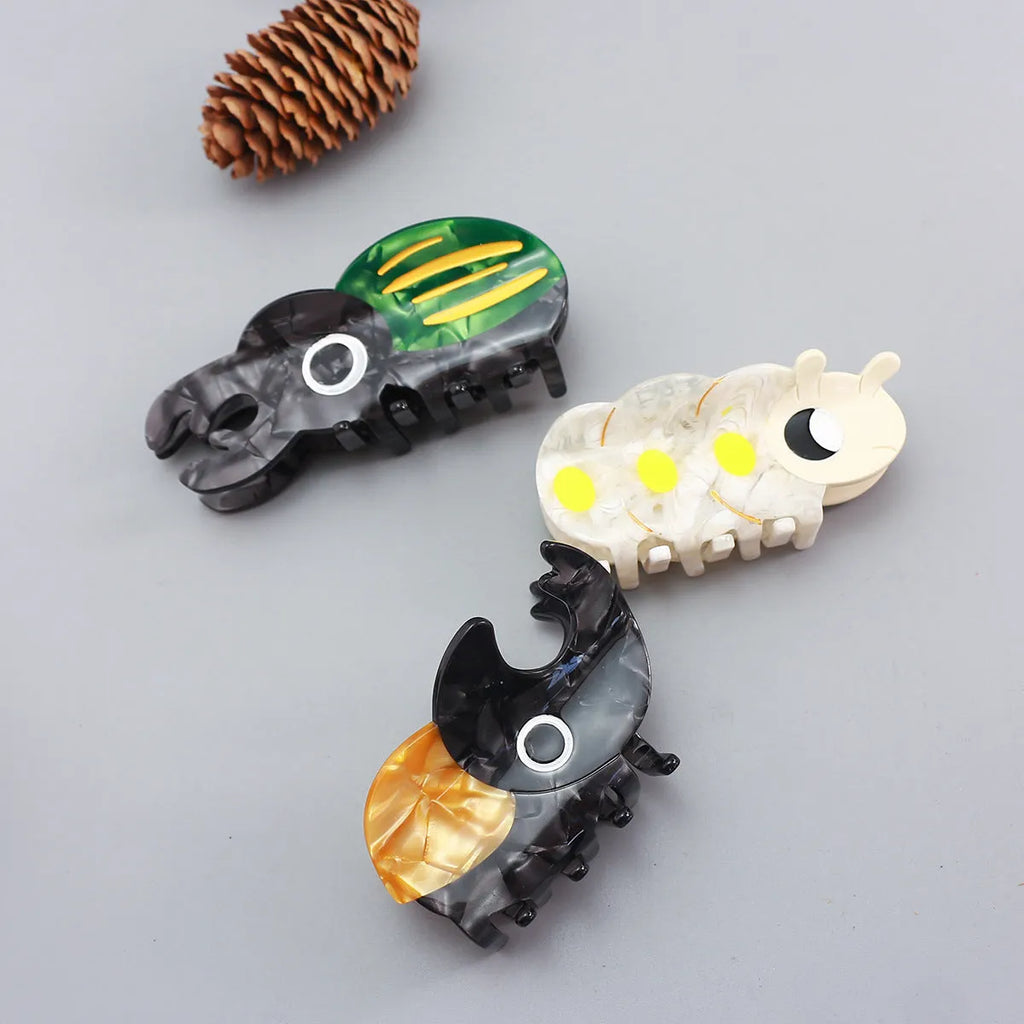Cellulose acetate beetle grip with insect biology design in green, orange, or white colour options