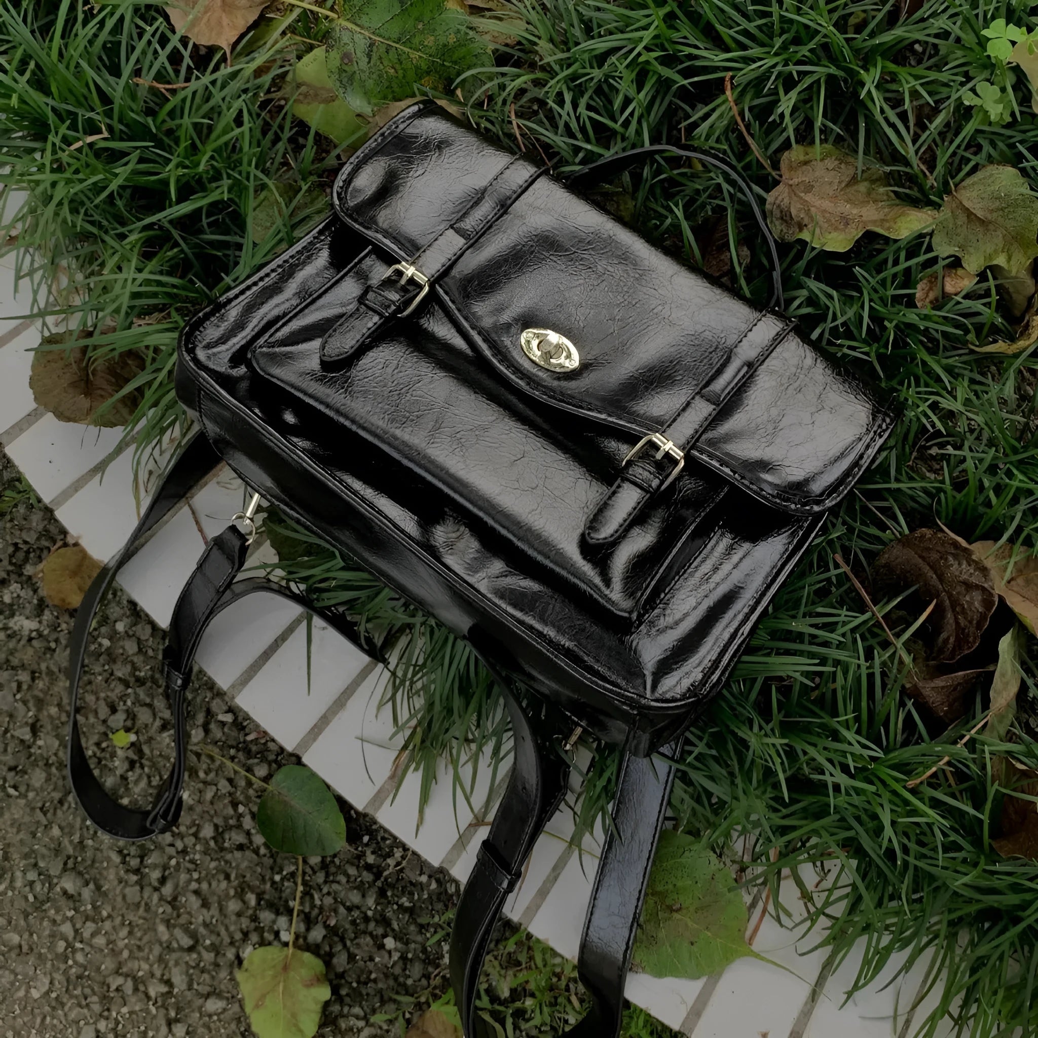 Black college style messenger bag made from oil wax leather PU material with dimensions of 35cm length