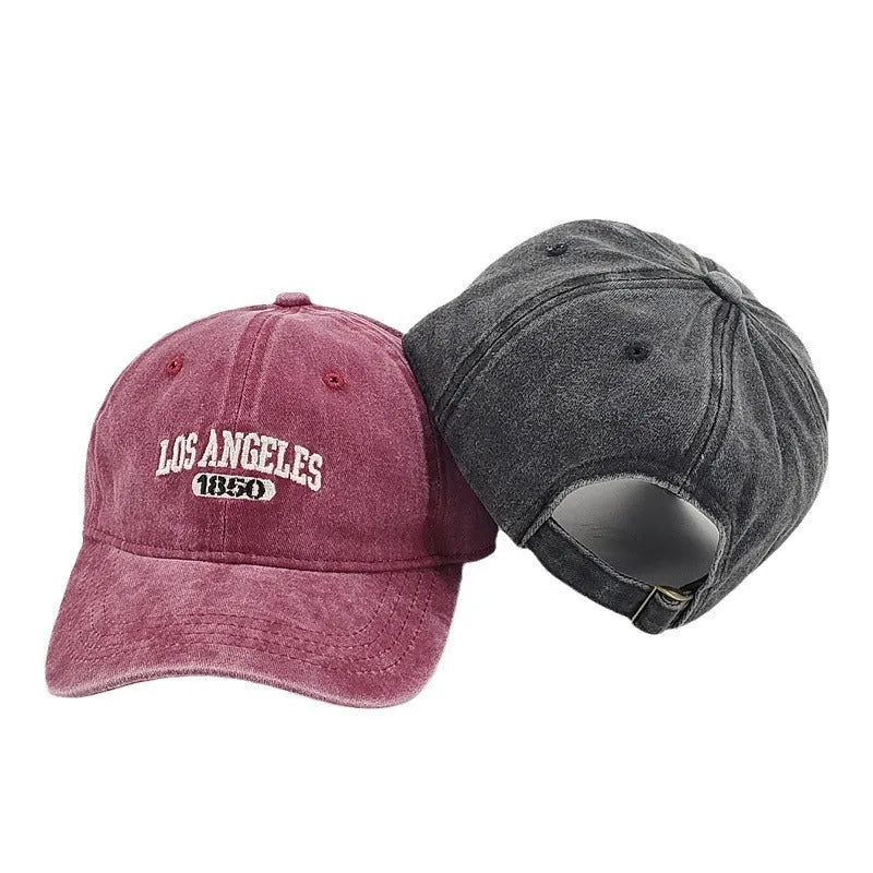 Retro personalised distressed acrylic peaked cap with embroidered letters, shown on adjustable strap.