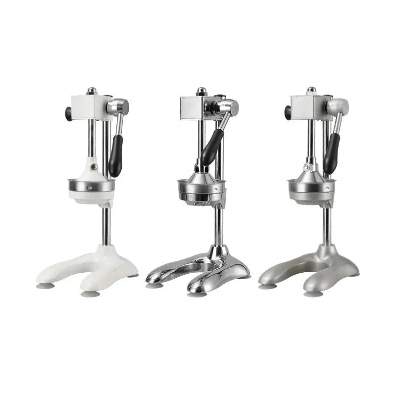 Vertical stainless steel manual citrus juicer on a kitchen countertop.
