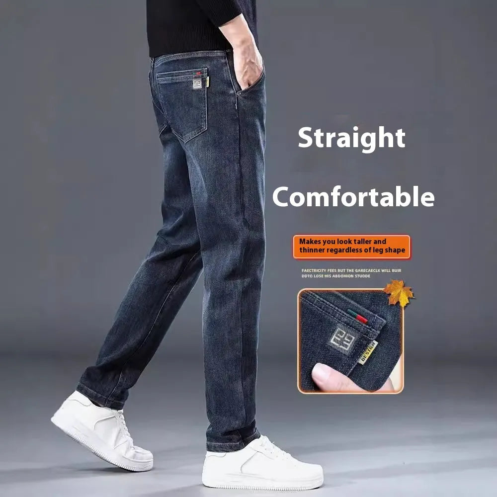 Blue grey slim straight casual trousers with a mid waist and zip fly on a neutral background.