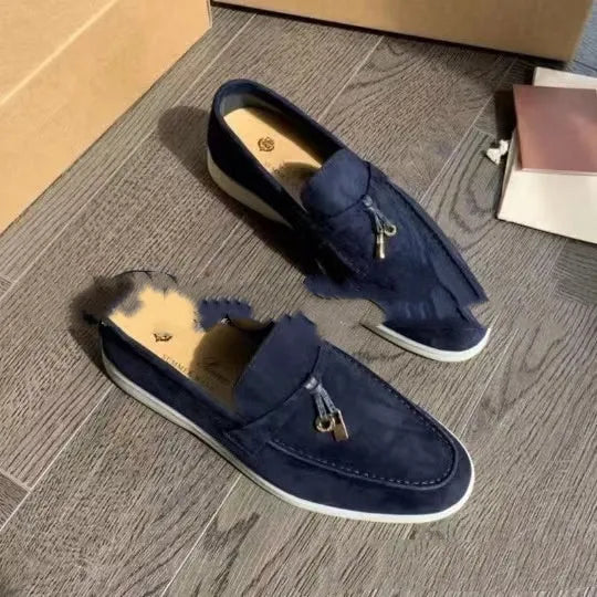 Casual slip-on Gommino loafers in black with round toe, rubber sole, and high-top design.