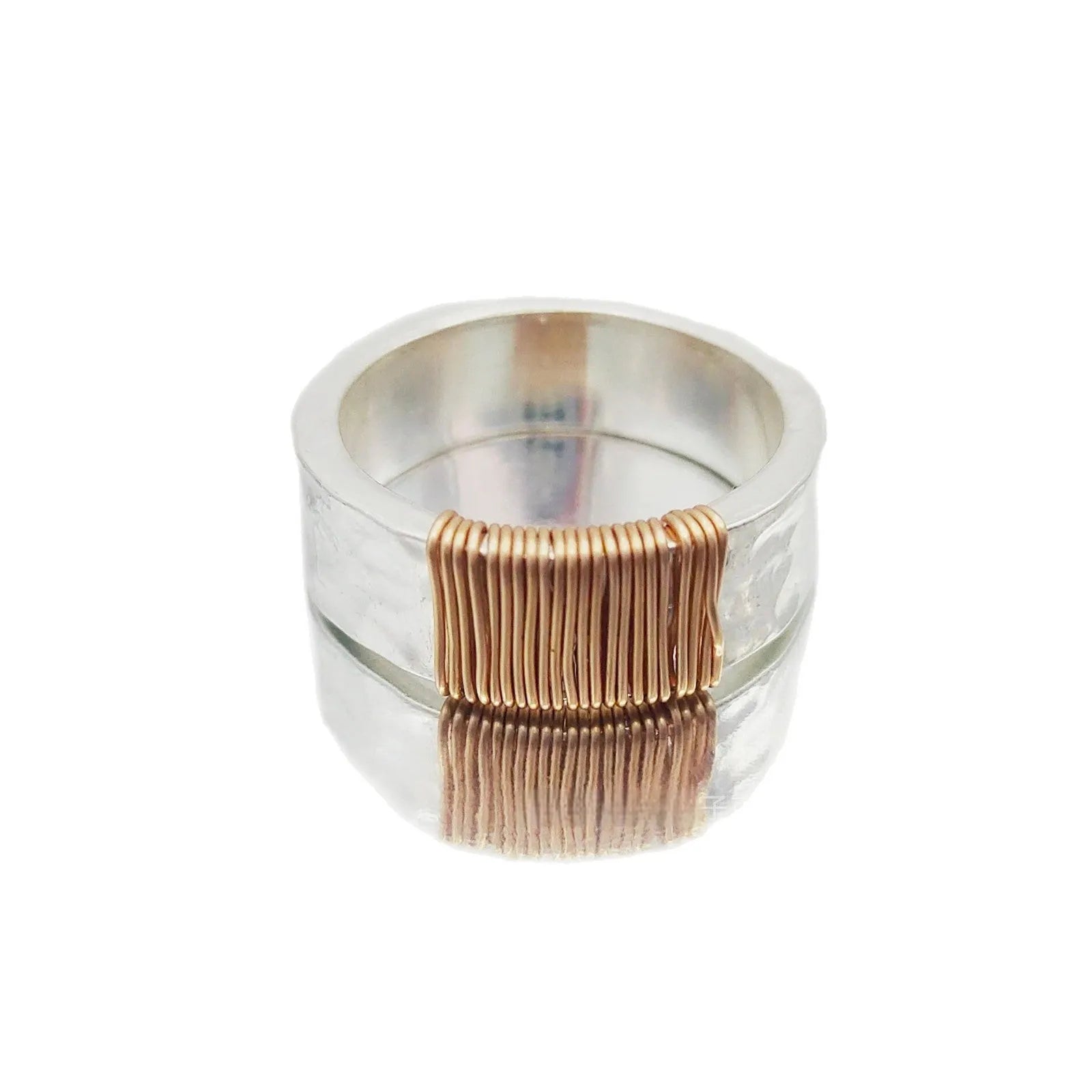 Copper geometric simple bracelet with silver gold coil finish and wide ring design.