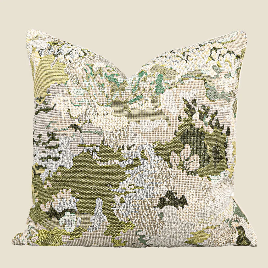 Green abstract plants and flowers pattern wool blend cushion cover on a sofa, showing square and waist pillow sizes.