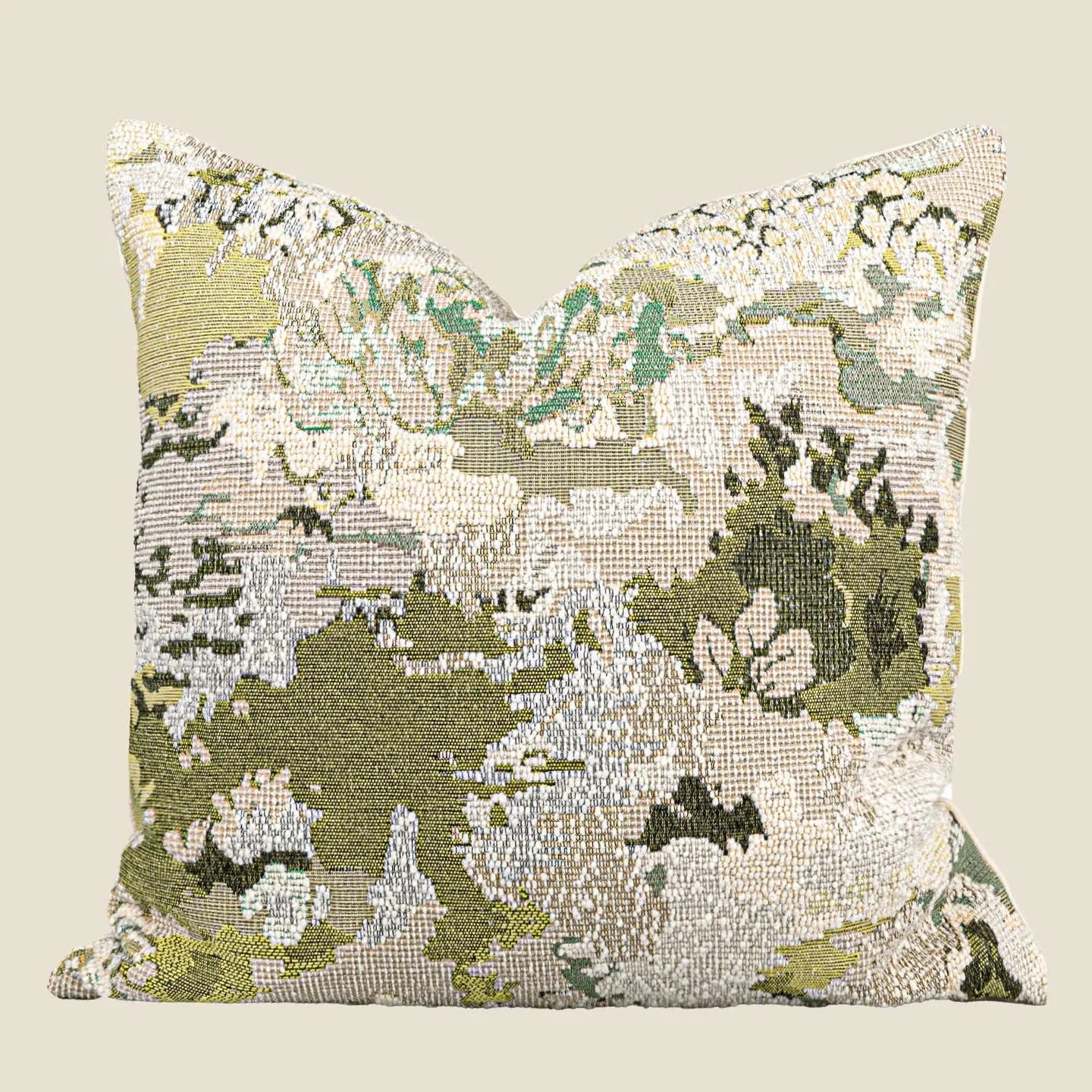 Green abstract plants and flowers pattern wool blend cushion cover on a sofa, showing square and waist pillow sizes.