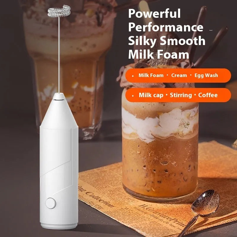 Mini handheld electric milk frother in black, white, or khaki with a stainless steel whisk and USB charging port.