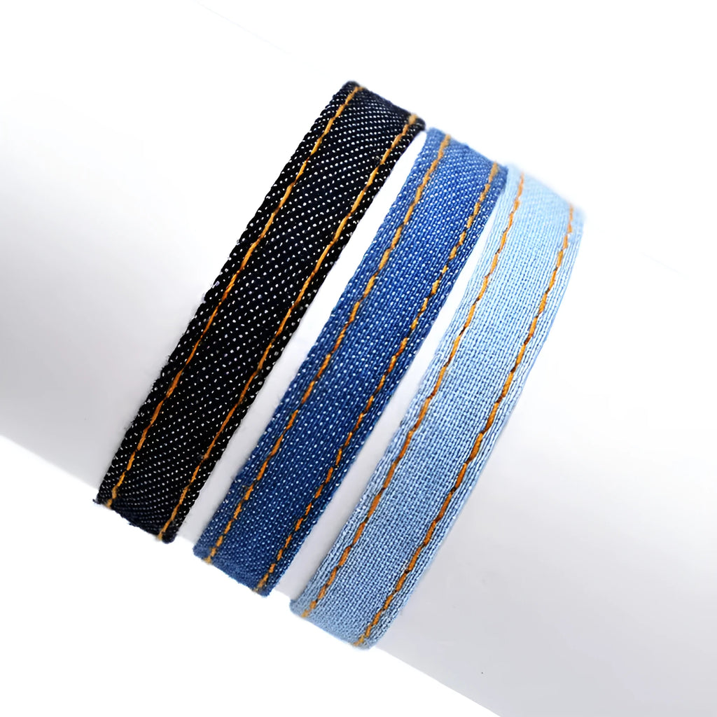 Unisex denim fabric bracelet with an attached carrying strap in a selection of colours.
