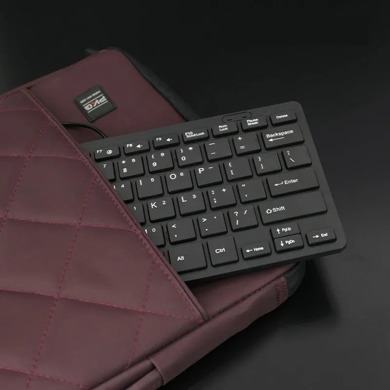 Wired USB mini keyboard in four colour options showing compact design and 1.3m cable
