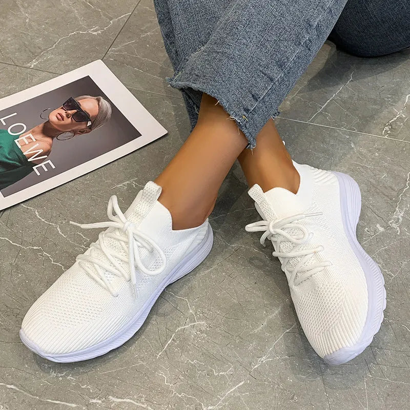 Women's low-top mesh breathable tennis shoes in creamy white, orange, and gray colours.