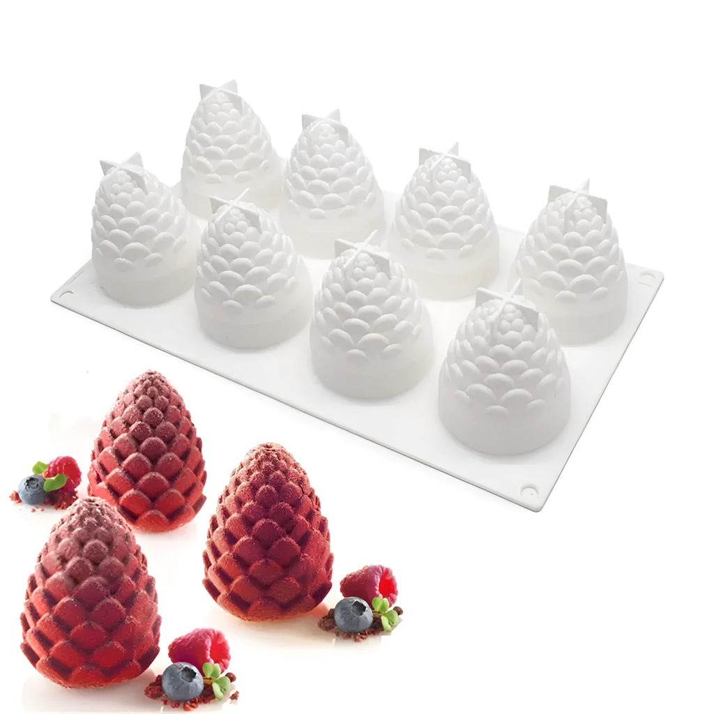 Six-cavity silicone baking mould showing pineapple and pine cone shapes