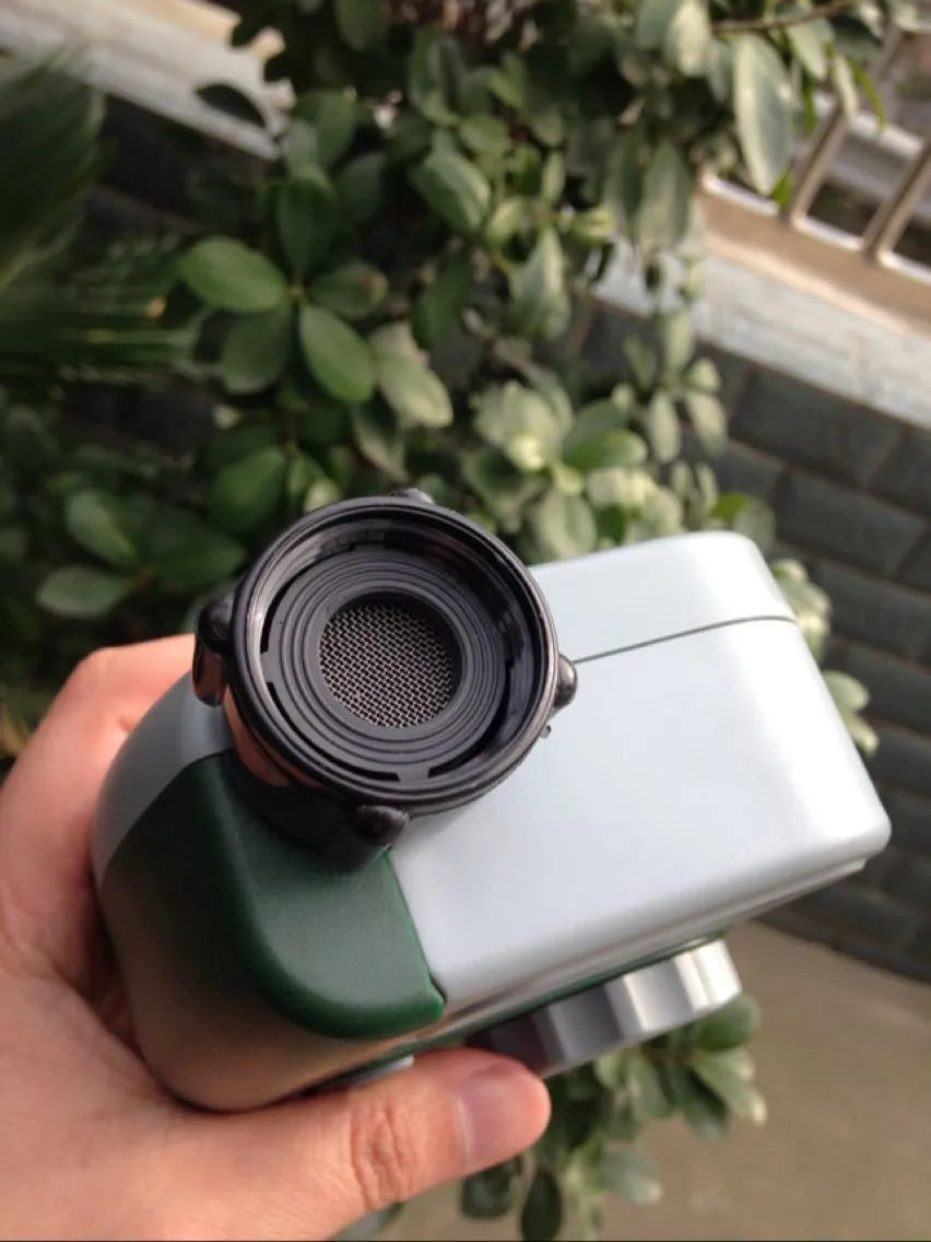 Green programmable digital hose timer with copper faucet connector and large digital display for automatic garden watering