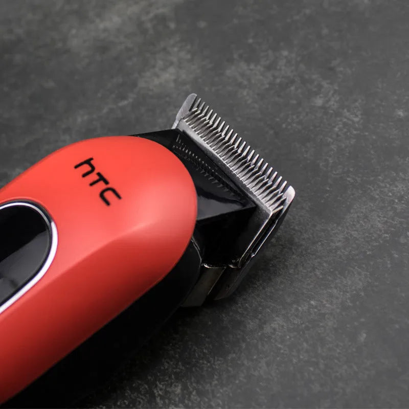 Professional digital electric hair clipper in black, red, or white with four limiting combs and accessories.