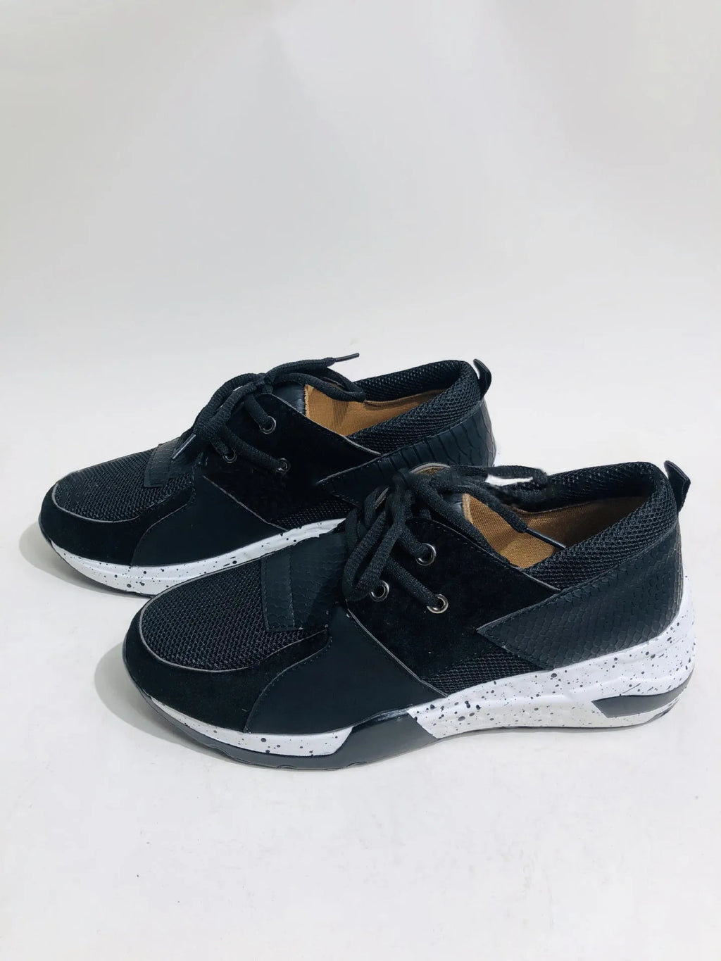 Women's wedge heel flat sneakers in breathable fabric showing round toe and slip-on design