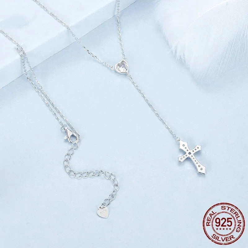 Simple silver love cross pendant on a V-neck O-ring chain, colour BSN384.