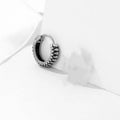 Silver geometric alloy earrings with a retro twist design and stainless steel stripes.