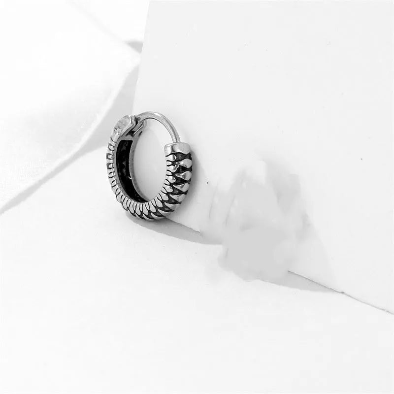 Silver geometric alloy earrings with a retro twist design and stainless steel stripes.