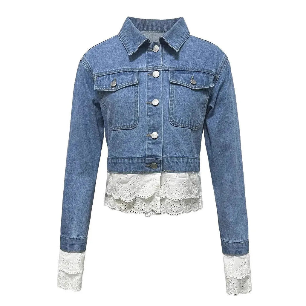 Blue women's denim jacket with lace stitching detail on the front, with long sleeves.