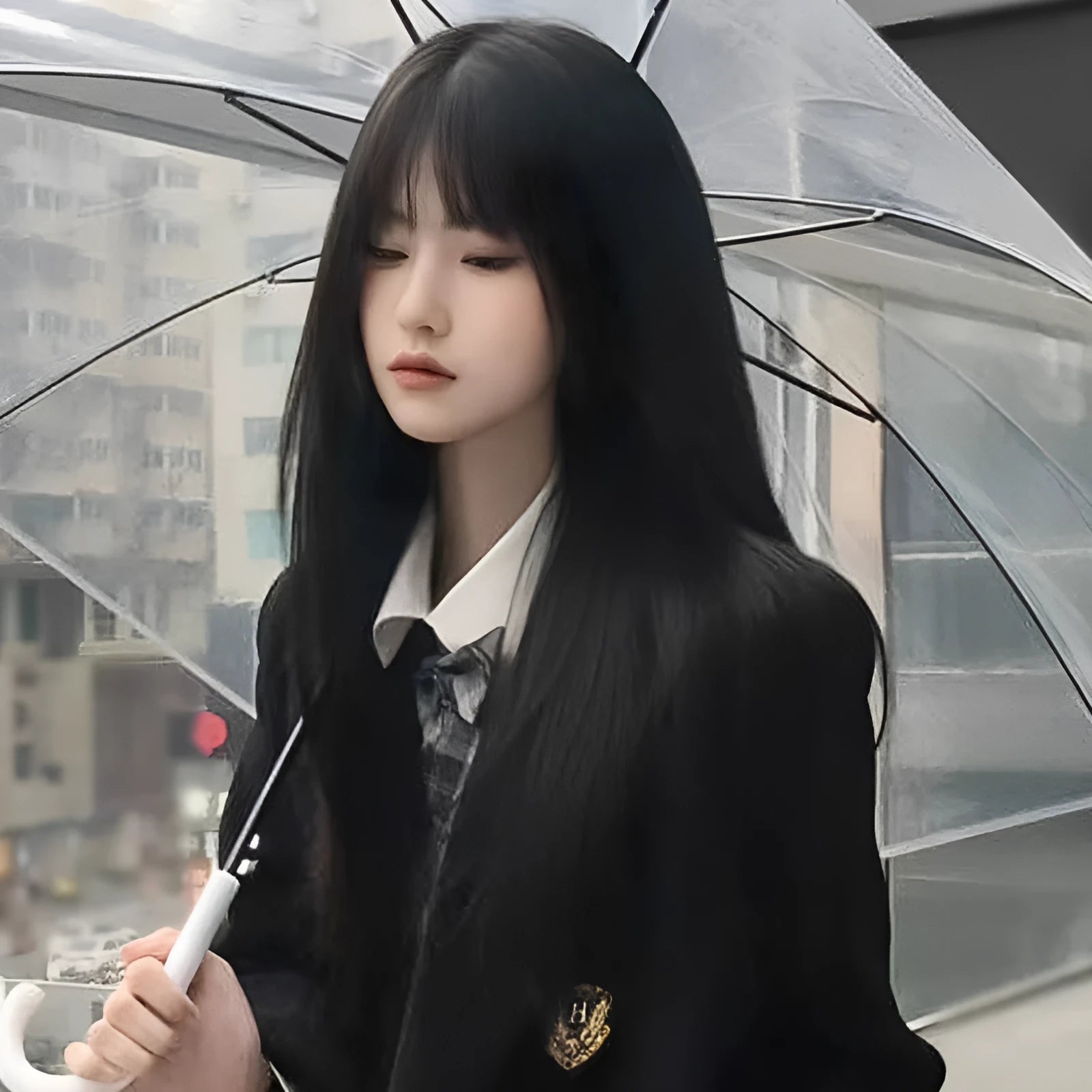 Long straight synthetic wig with bangs in brown-black colour on display