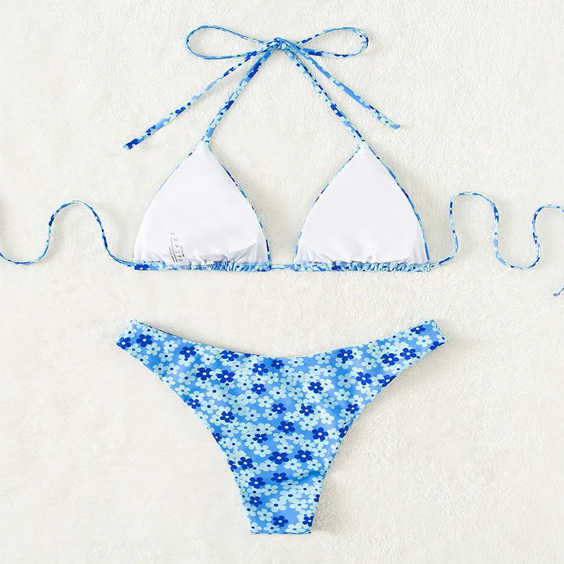 Women's blue printed swimsuit with lace-up front and high-leg split design
