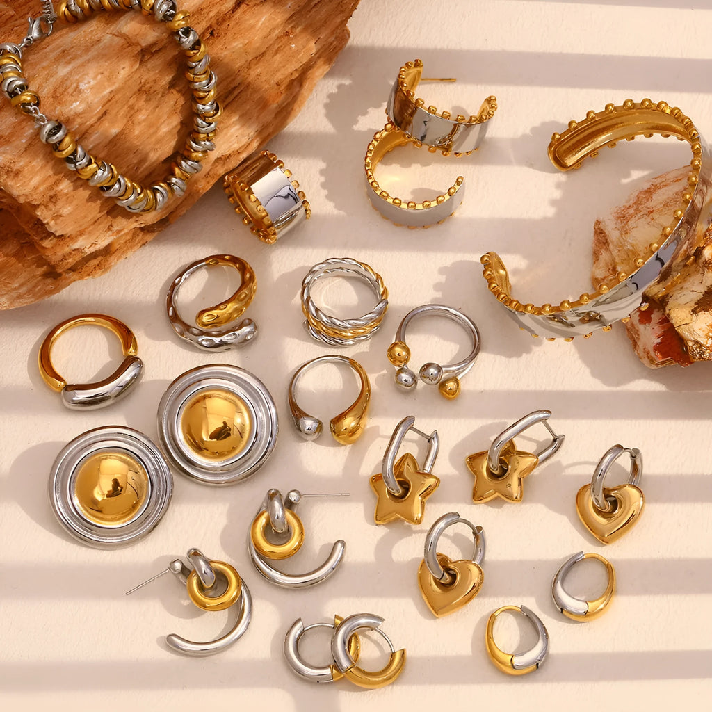 Gold electroplated stainless steel jewellery set including earrings, bracelet and necklace with geometric designs